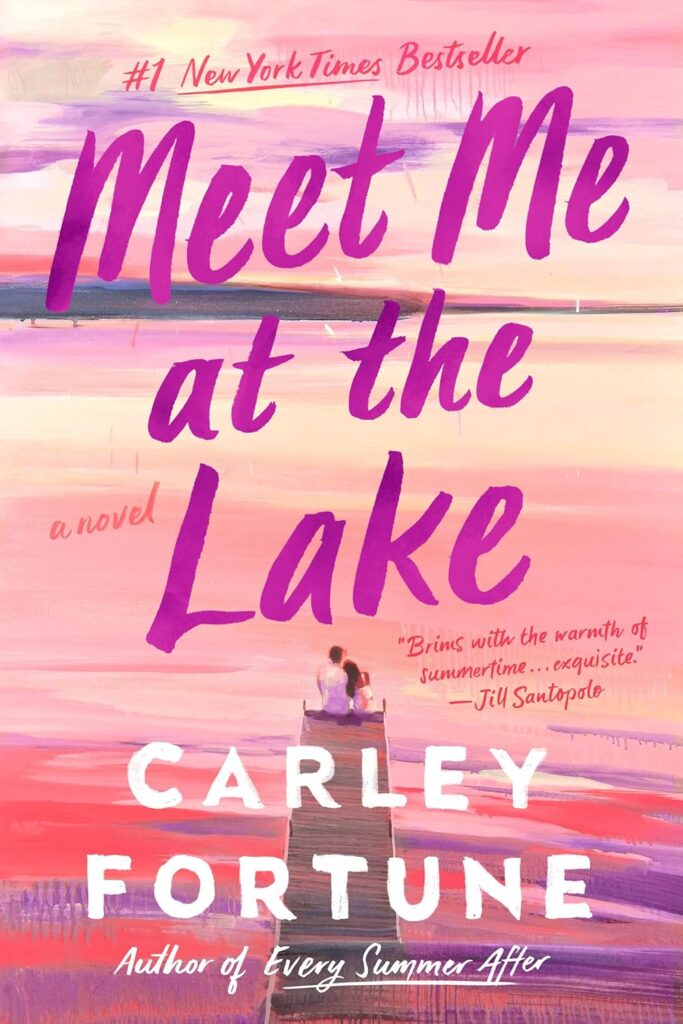 Cover of Meet Me at the Lake shows a couple leaning against one another on the edge of a lake under a pink sky