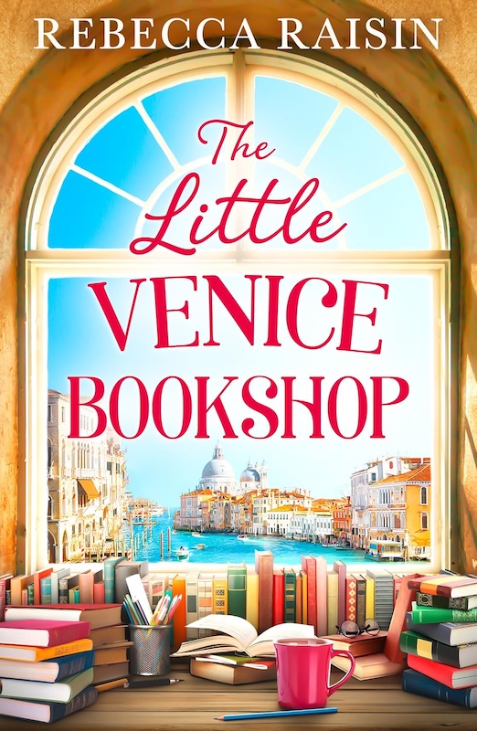 An interior shot of a bookshop looking out at the sea