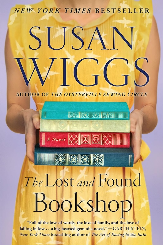Cover of Lost and Found Bookshop. Woman in a yellow dress holding a stack of books